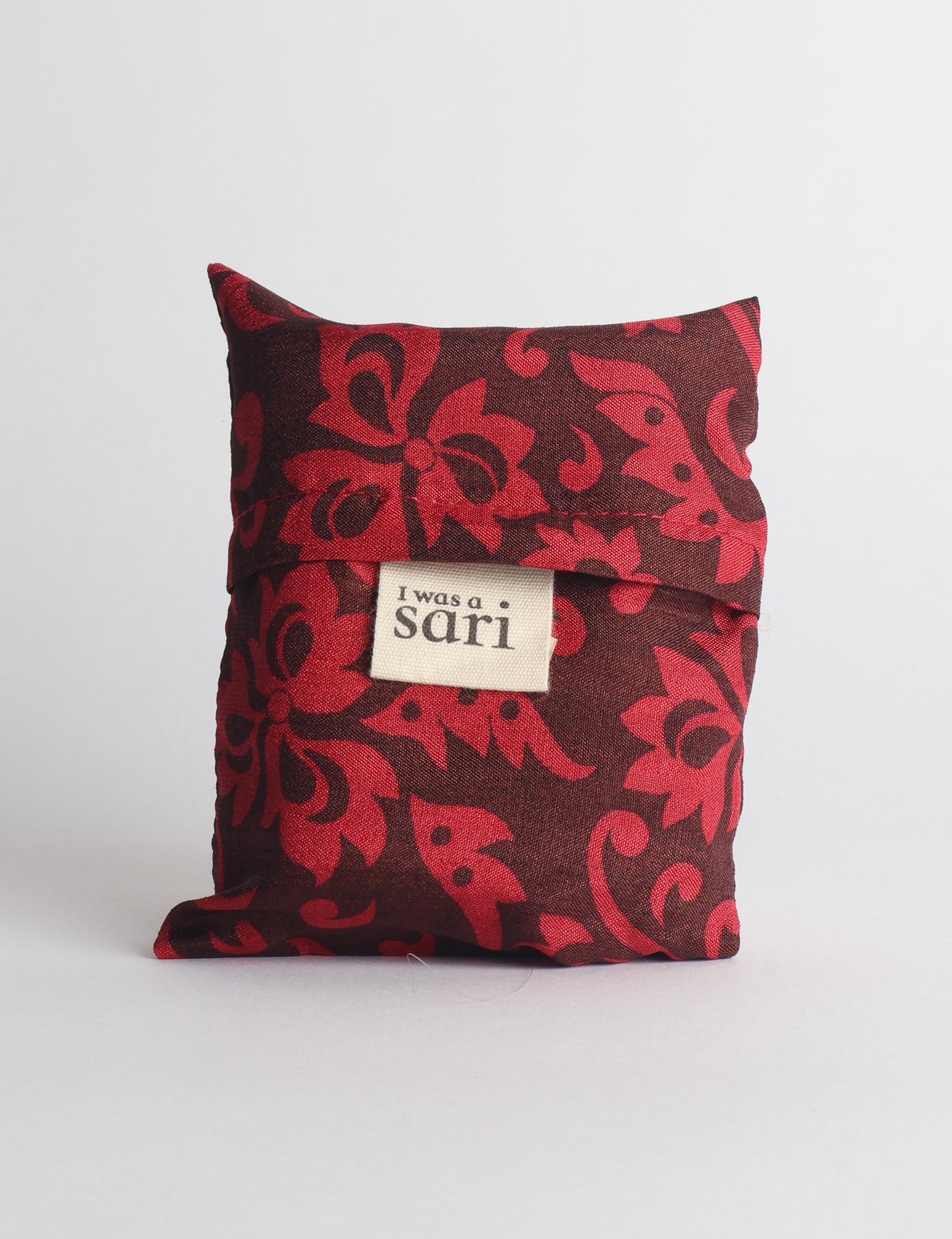 Stay eco-conscious with our Reusable Bag, handmade by Indian artisans from pre-loved saris. Silky and lightweight, this foldaway bag is perfect for your on-the-go lifestyle. Each piece is a unique statement of ethical fashion, embracing sustainability and style.