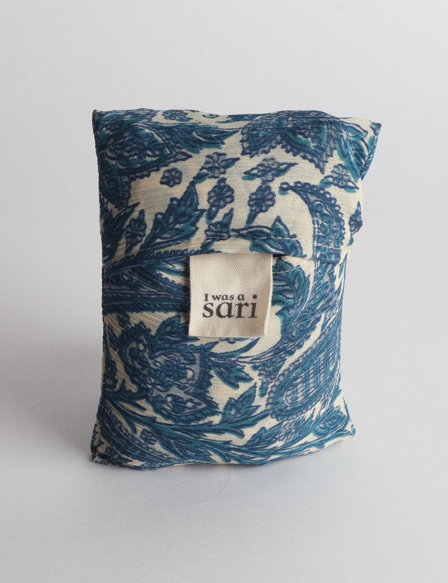Stay eco-conscious with our Reusable Bag, handmade by Indian artisans from pre-loved saris. Silky and lightweight, this foldaway bag is perfect for your on-the-go lifestyle. Each piece is a unique statement of ethical fashion, embracing sustainability and style.