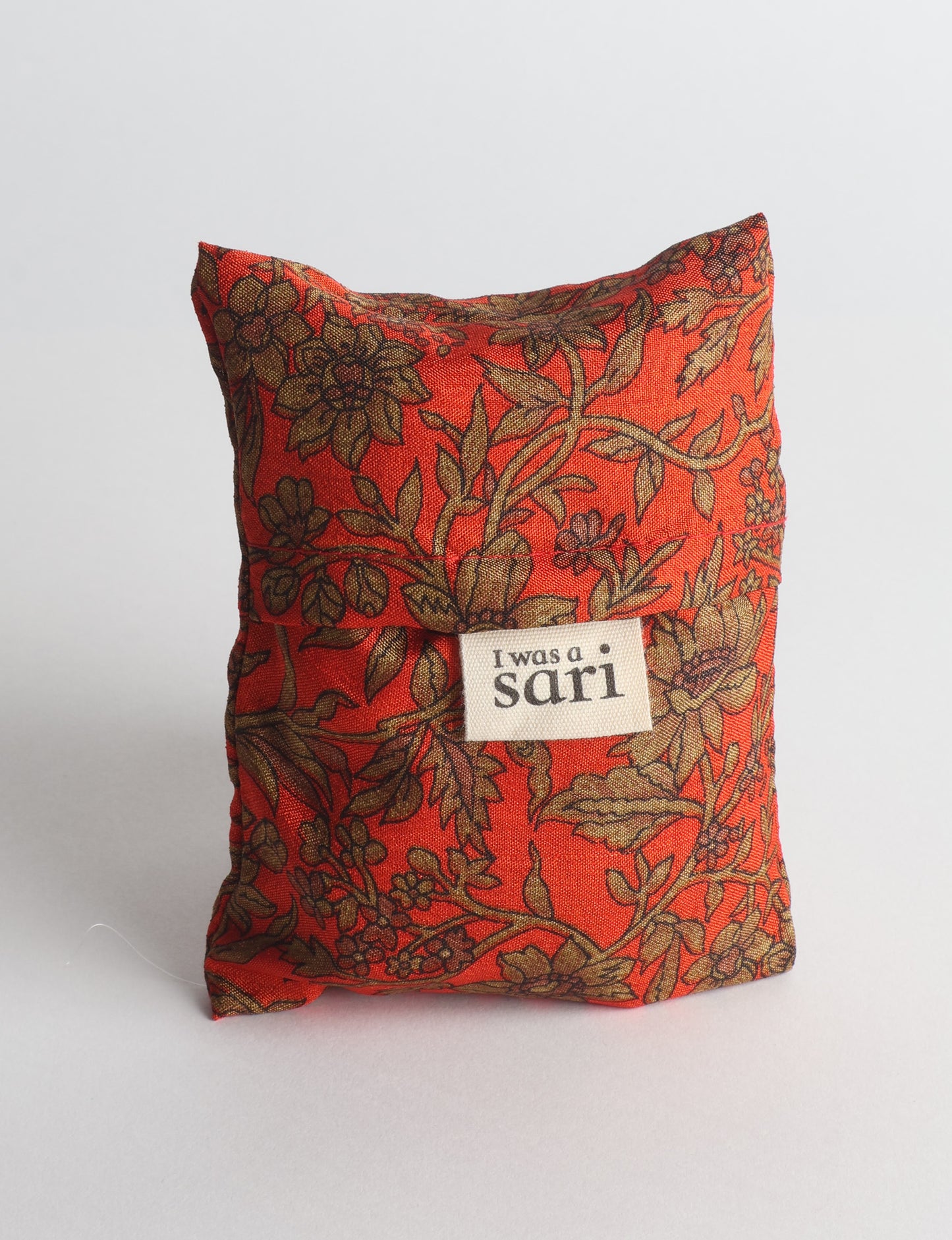 Stay eco-conscious with our Reusable Bag, handmade by Indian artisans from pre-loved saris. Silky and lightweight, this foldaway bag is perfect for your on-the-go lifestyle. Each piece is a unique statement of ethical fashion, embracing sustainability and style.