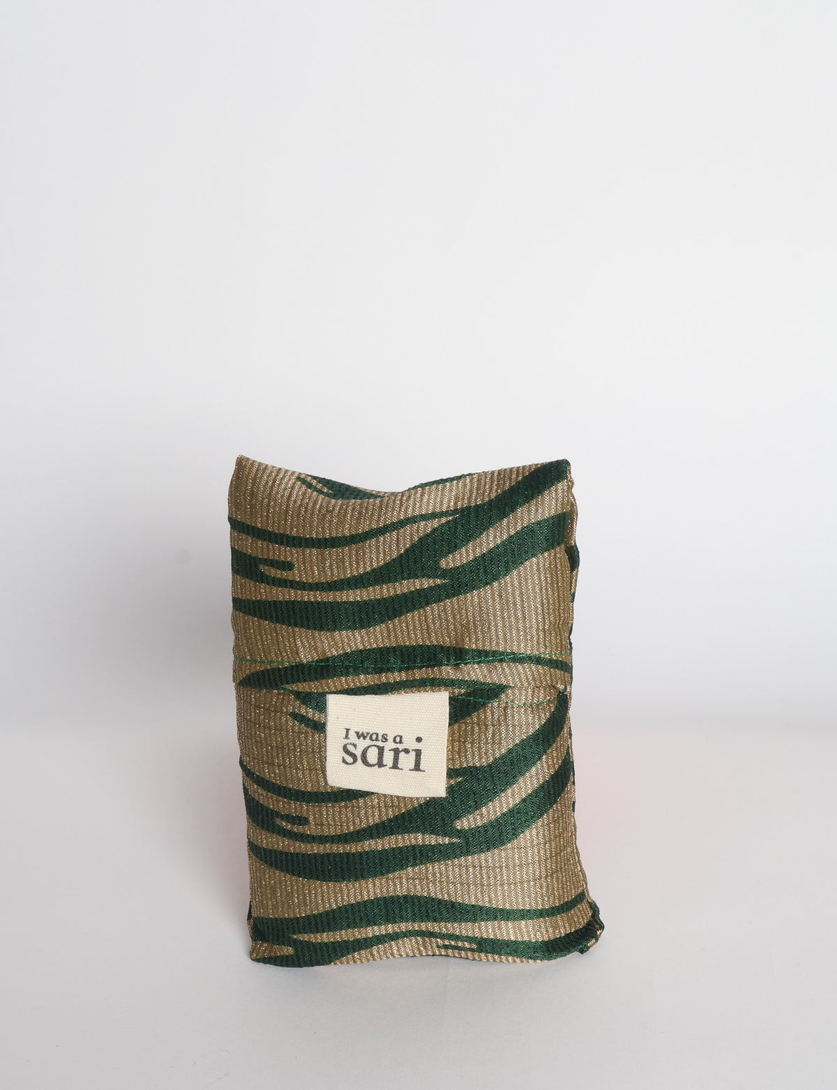 Blue reusable bag with multicolor tropical floral pattern folded with "I was a sari" label visible on front