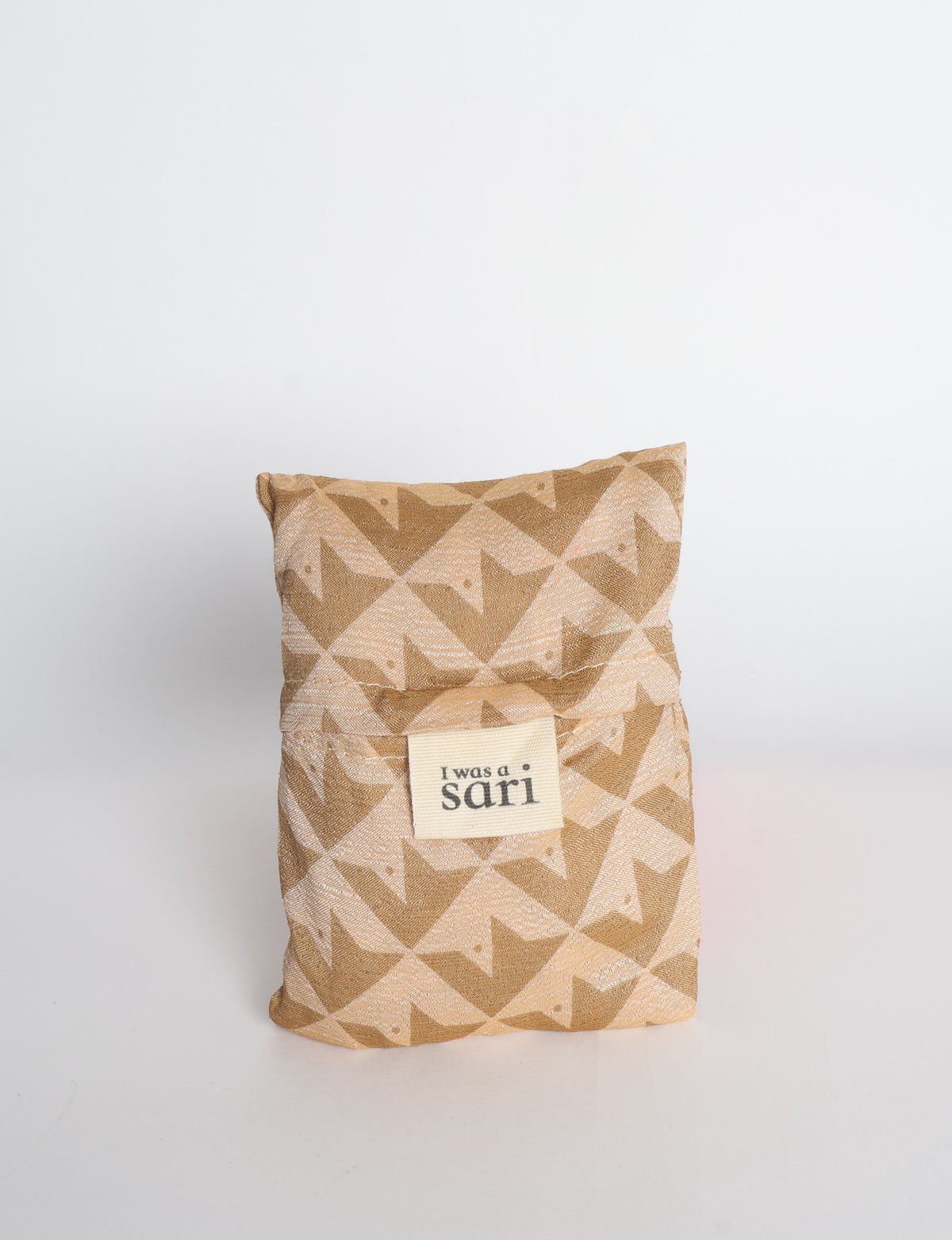 Blue reusable bag with multicolor tropical floral pattern folded with "I was a sari" label visible on front