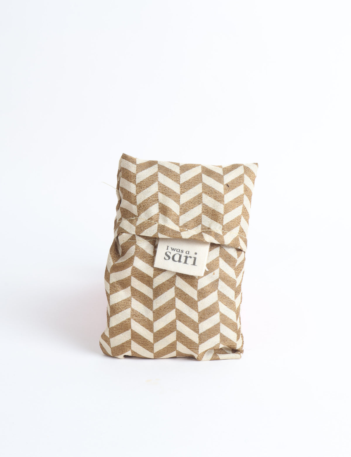 Blue reusable bag with multicolor tropical floral pattern folded with "I was a sari" label visible on front