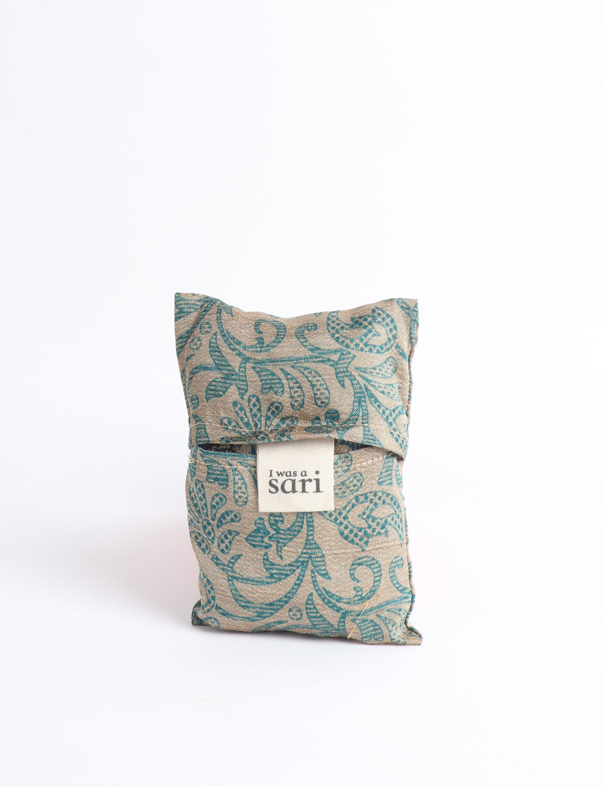 Blue reusable bag with multicolor tropical floral pattern folded with "I was a sari" label visible on front