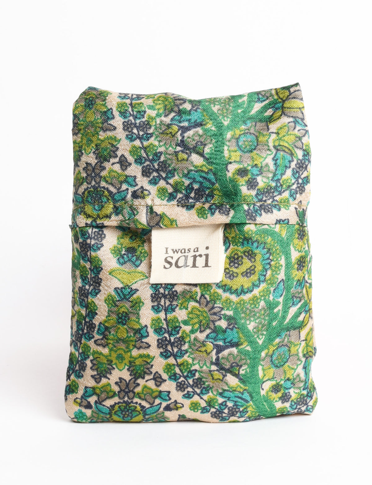 Blue reusable bag with tropical floral pattern in pink, yellow, and green, shown hanging with handles visible