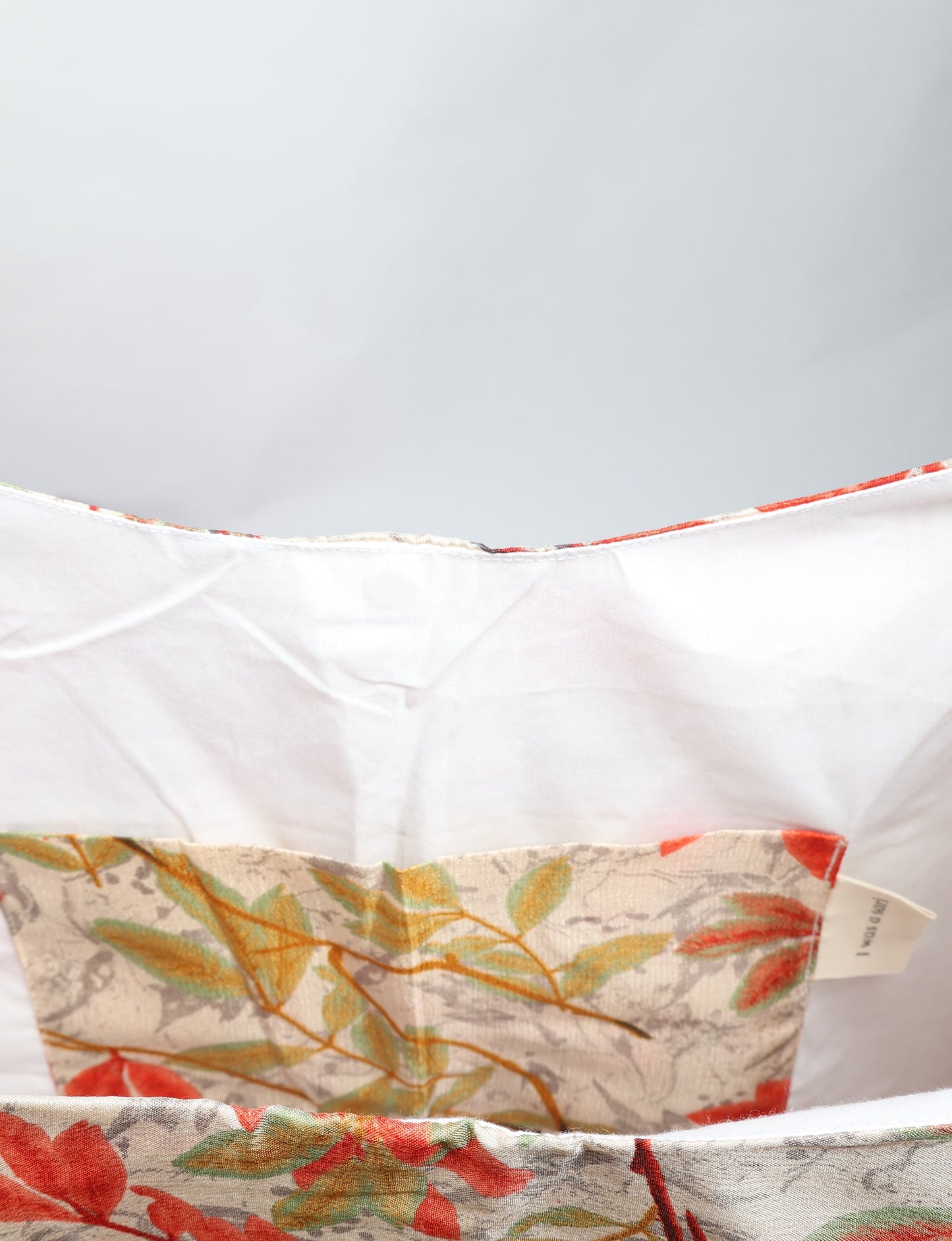 Trapeze bag made from repurposed sari fabric, featuring bold patterns and eco friendly cloth design—part of a sustainable women's clothing collection.