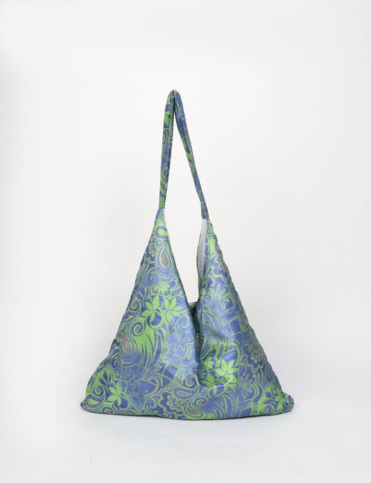Trapeze bag made from repurposed sari fabric, featuring bold patterns and eco friendly cloth design—part of a sustainable women's clothing collection.