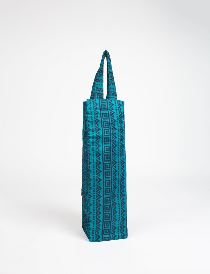 Blue fabric wine bag with dark geometric patterns, rectangular shape, and two handles, shown standing upright