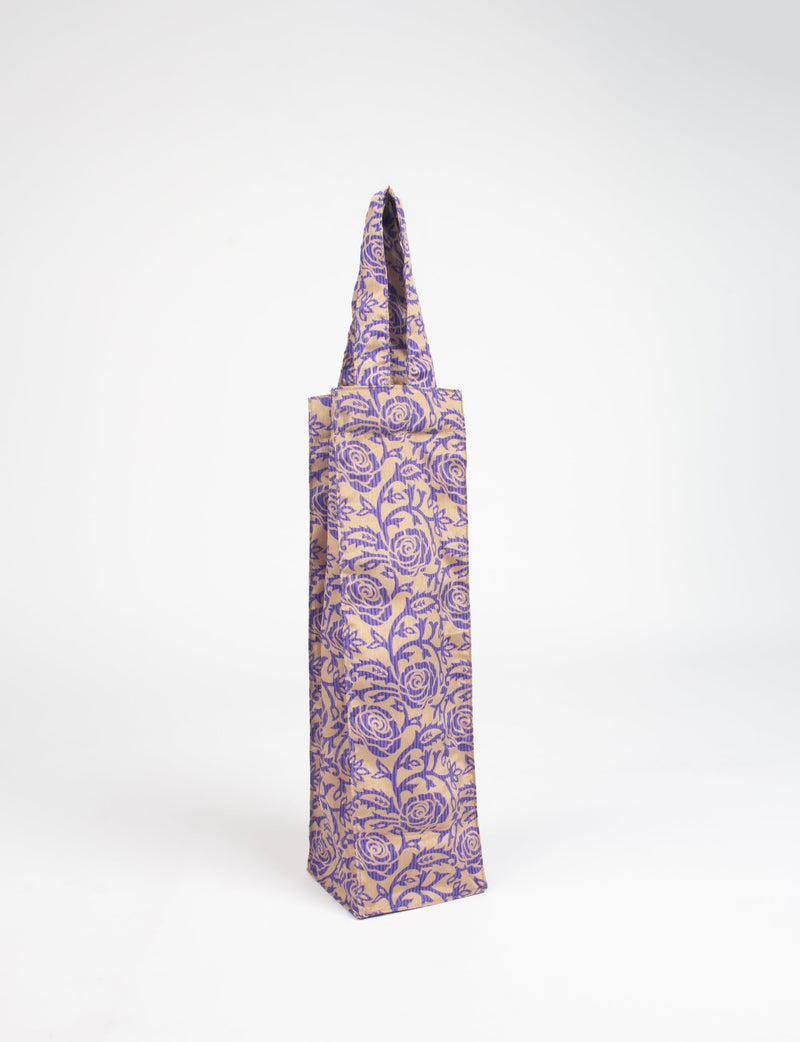 Blue and beige wine bag with tropical floral pattern, standing upright with handle visible, front view on white background