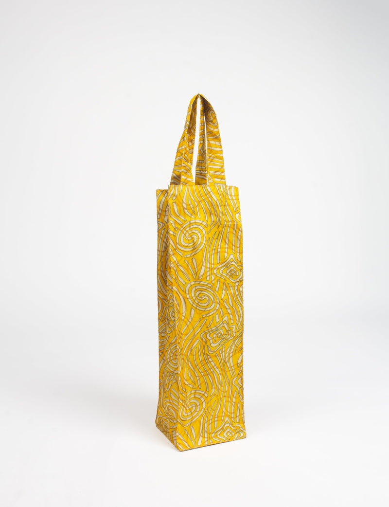 Yellow fabric wine bag with abstract swirl and line patterns, standing upright with handles visible at top