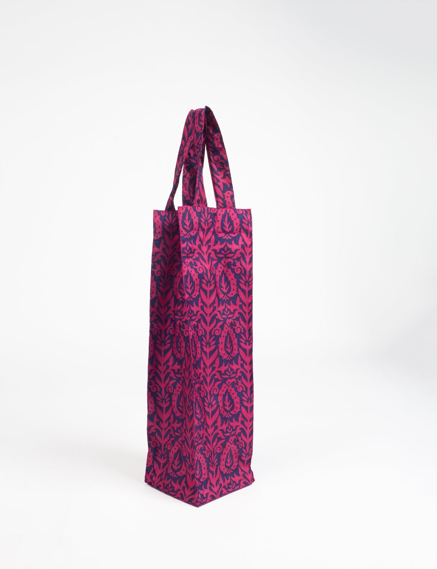 Indulge in eco-conscious wine storage with our Wine Bags, handcrafted from pre-loved saris by Mumbai craftswomen. Sturdy and stylish, these rectangular bags with small handles ensure a leak-free, eco-friendly solution for carrying and storing regular and sparkling wine bottles.