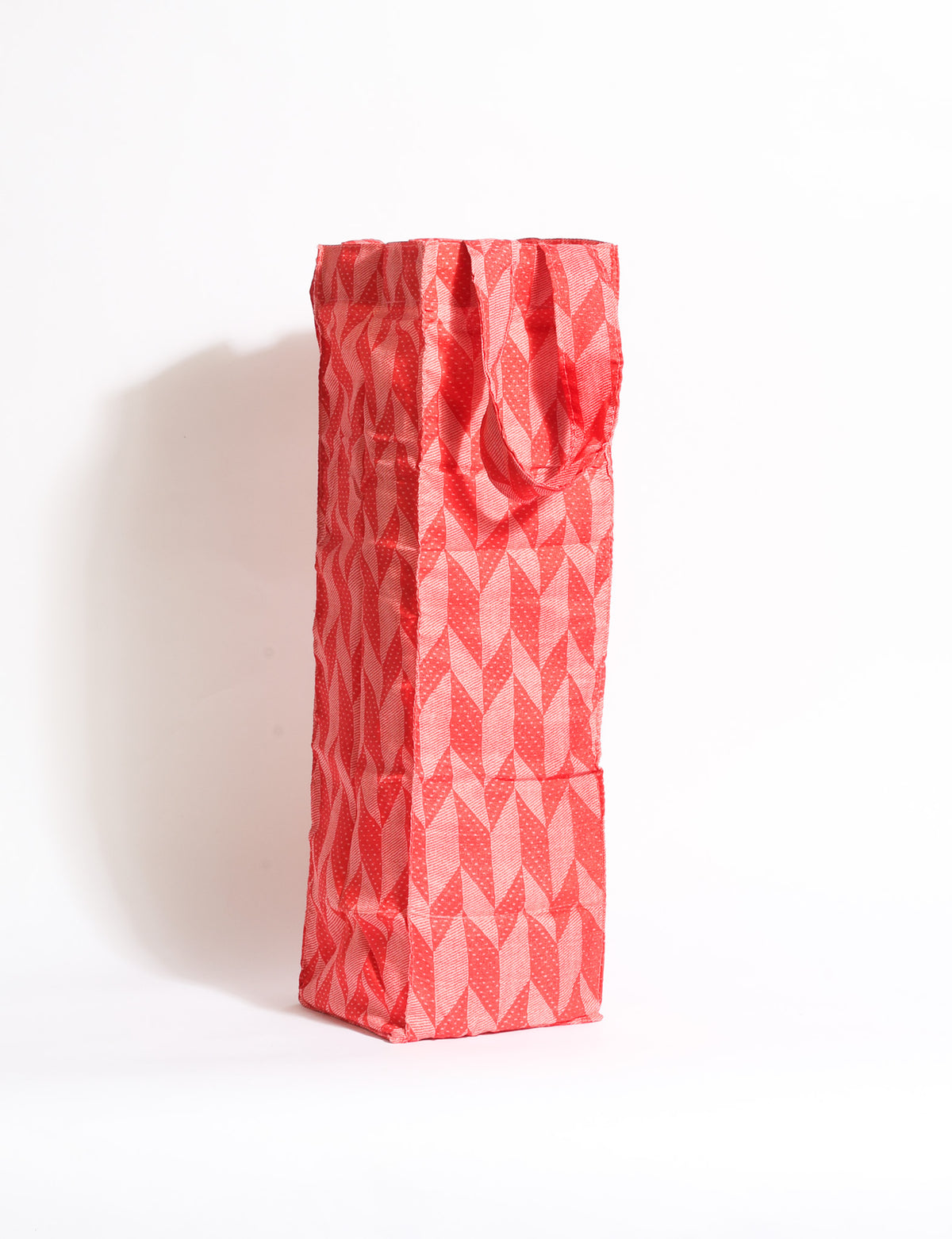 Indulge in eco-conscious wine storage with our Wine Bags, handcrafted from pre-loved saris by Mumbai craftswomen. Sturdy and stylish, these rectangular bags with small handles ensure a leak-free, eco-friendly solution for carrying and storing regular and sparkling wine bottles.