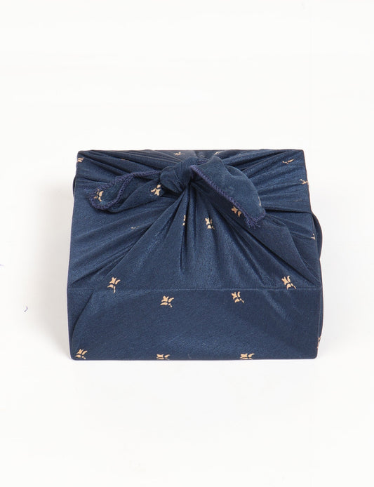 A delicately handcrafted wrap made from recycled sari offcuts, blending sustainable fashion with conscious design. This eco-friendly product showcases the beauty of upcycling and green fashion, making it a perfect accessory for those supporting circular fashion and products made from textile waste.