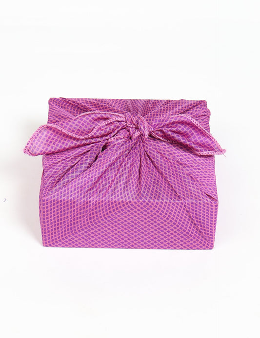 A delicately handcrafted wrap made from recycled sari offcuts, blending sustainable fashion with conscious design. This eco-friendly product showcases the beauty of upcycling and green fashion, making it a perfect accessory for those supporting circular fashion and products made from textile waste.