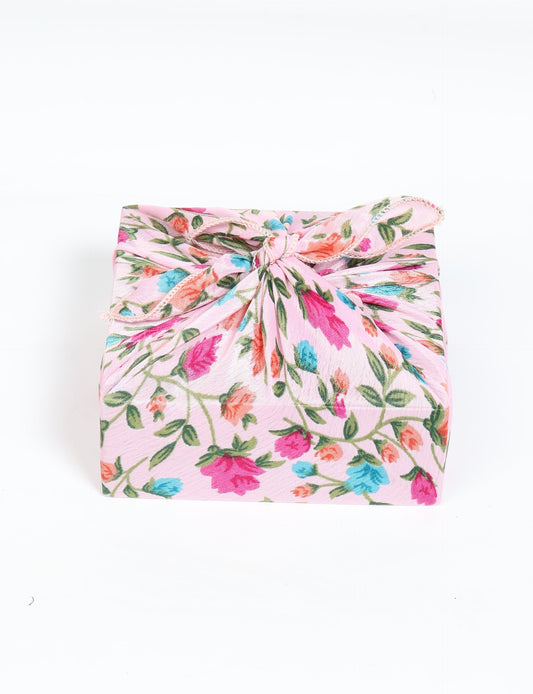 A delicately handcrafted wrap made from recycled sari offcuts, blending sustainable fashion with conscious design. This eco-friendly product showcases the beauty of upcycling and green fashion, making it a perfect accessory for those supporting circular fashion and products made from textile waste.