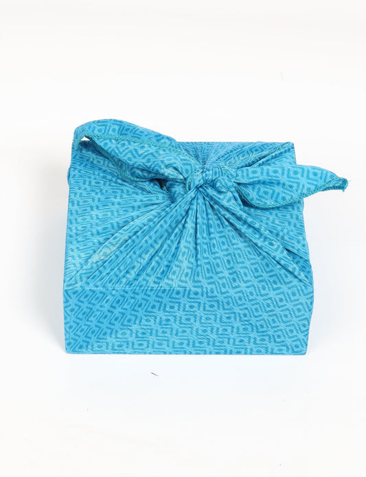 A delicately handcrafted wrap made from recycled sari offcuts, blending sustainable fashion with conscious design. This eco-friendly product showcases the beauty of upcycling and green fashion, making it a perfect accessory for those supporting circular fashion and products made from textile waste.