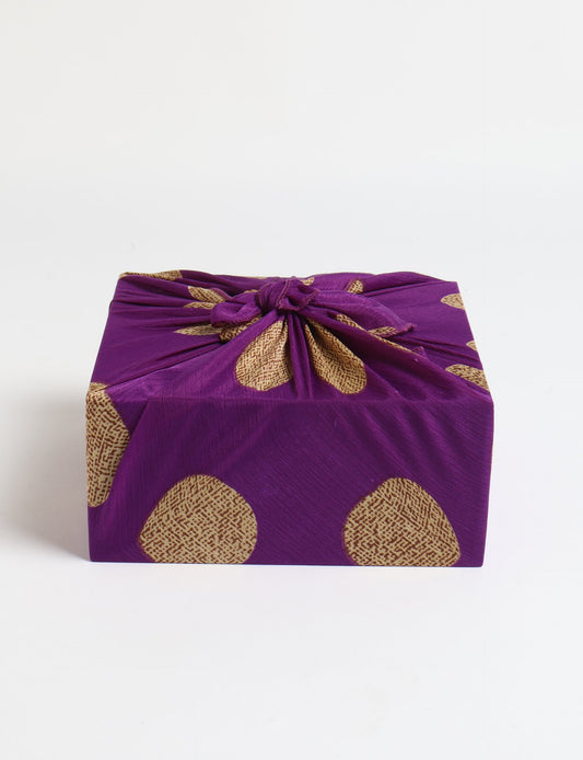 A delicately handcrafted wrap made from recycled sari offcuts, blending sustainable fashion with conscious design. This eco-friendly product showcases the beauty of upcycling and green fashion, making it a perfect accessory for those supporting circular fashion and products made from textile waste.