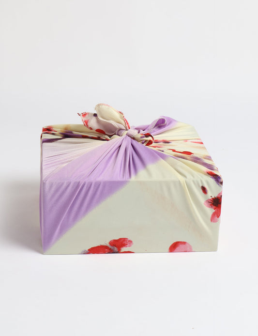 A delicately handcrafted wrap made from recycled sari offcuts, blending sustainable fashion with conscious design. This eco-friendly product showcases the beauty of upcycling and green fashion, making it a perfect accessory for those supporting circular fashion and products made from textile waste.