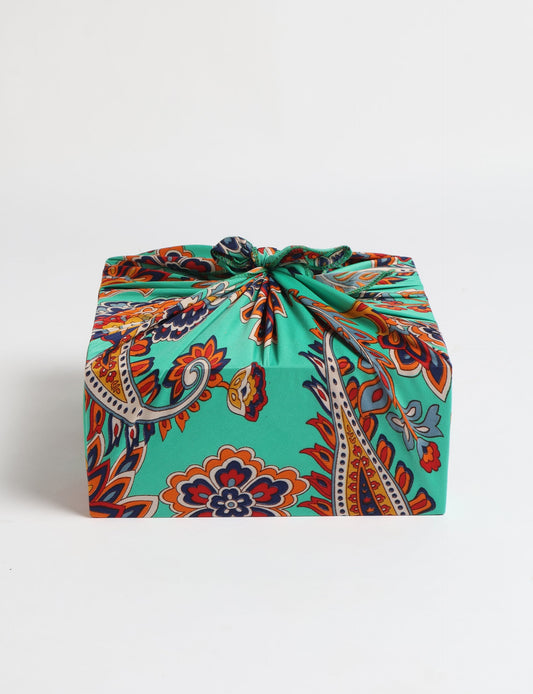 A delicately handcrafted wrap made from recycled sari offcuts, blending sustainable fashion with conscious design. This eco-friendly product showcases the beauty of upcycling and green fashion, making it a perfect accessory for those supporting circular fashion and products made from textile waste.