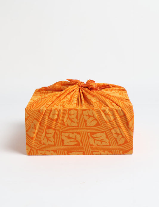 A delicately handcrafted wrap made from recycled sari offcuts, blending sustainable fashion with conscious design. This eco-friendly product showcases the beauty of upcycling and green fashion, making it a perfect accessory for those supporting circular fashion and products made from textile waste.