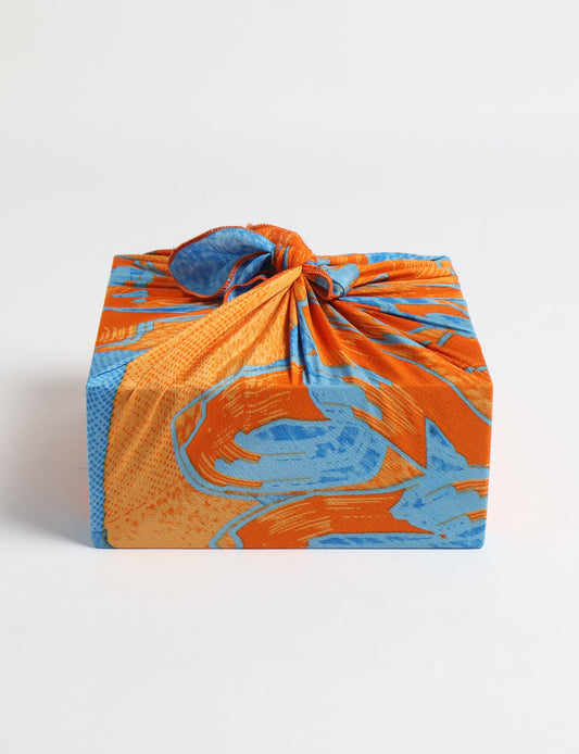 A delicately handcrafted wrap made from recycled sari offcuts, blending sustainable fashion with conscious design. This eco-friendly product showcases the beauty of upcycling and green fashion, making it a perfect accessory for those supporting circular fashion and products made from textile waste.