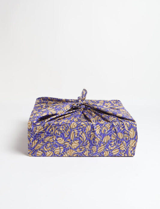 A delicately handcrafted wrap made from recycled sari offcuts, blending sustainable fashion with conscious design. This eco-friendly product showcases the beauty of upcycling and green fashion, making it a perfect accessory for those supporting circular fashion and products made from textile waste.