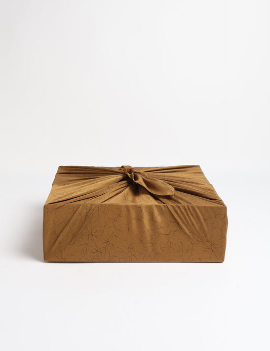 A delicately handcrafted wrap made from recycled sari offcuts, blending sustainable fashion with conscious design. This eco-friendly product showcases the beauty of upcycling and green fashion, making it a perfect accessory for those supporting circular fashion and products made from textile waste.