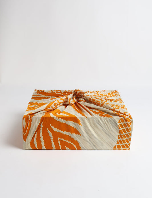 A delicately handcrafted wrap made from recycled sari offcuts, blending sustainable fashion with conscious design. This eco-friendly product showcases the beauty of upcycling and green fashion, making it a perfect accessory for those supporting circular fashion and products made from textile waste.