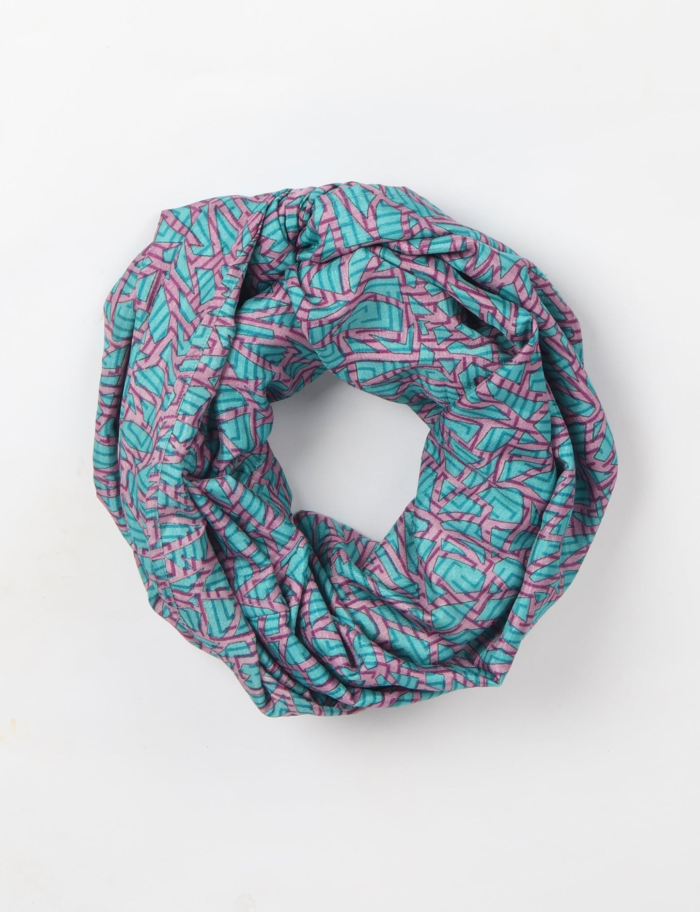 Sustainable style embraces you with our LOOP SCARF – an infinity-style scarf crafted from vibrant, pattern-rich saris. Handcrafted by experienced Mumbai-based artisans, this versatile scarf can be worn looped once or twice around your neck or as a head-wrap. From laid-back beach vacations to dress-to-impress dinners, this scarf is a timeless accessory.