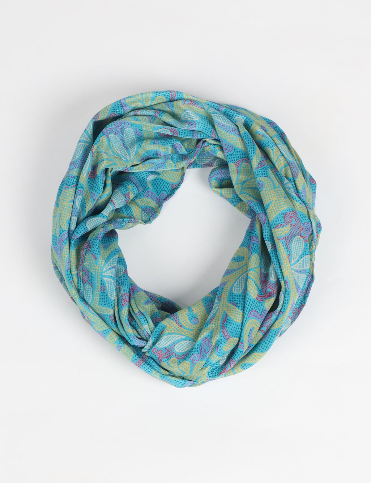 Sustainable style embraces you with our LOOP SCARF – an infinity-style scarf crafted from vibrant, pattern-rich saris. Handcrafted by experienced Mumbai-based artisans, this versatile scarf can be worn looped once or twice around your neck or as a head-wrap. From laid-back beach vacations to dress-to-impress dinners, this scarf is a timeless accessory.