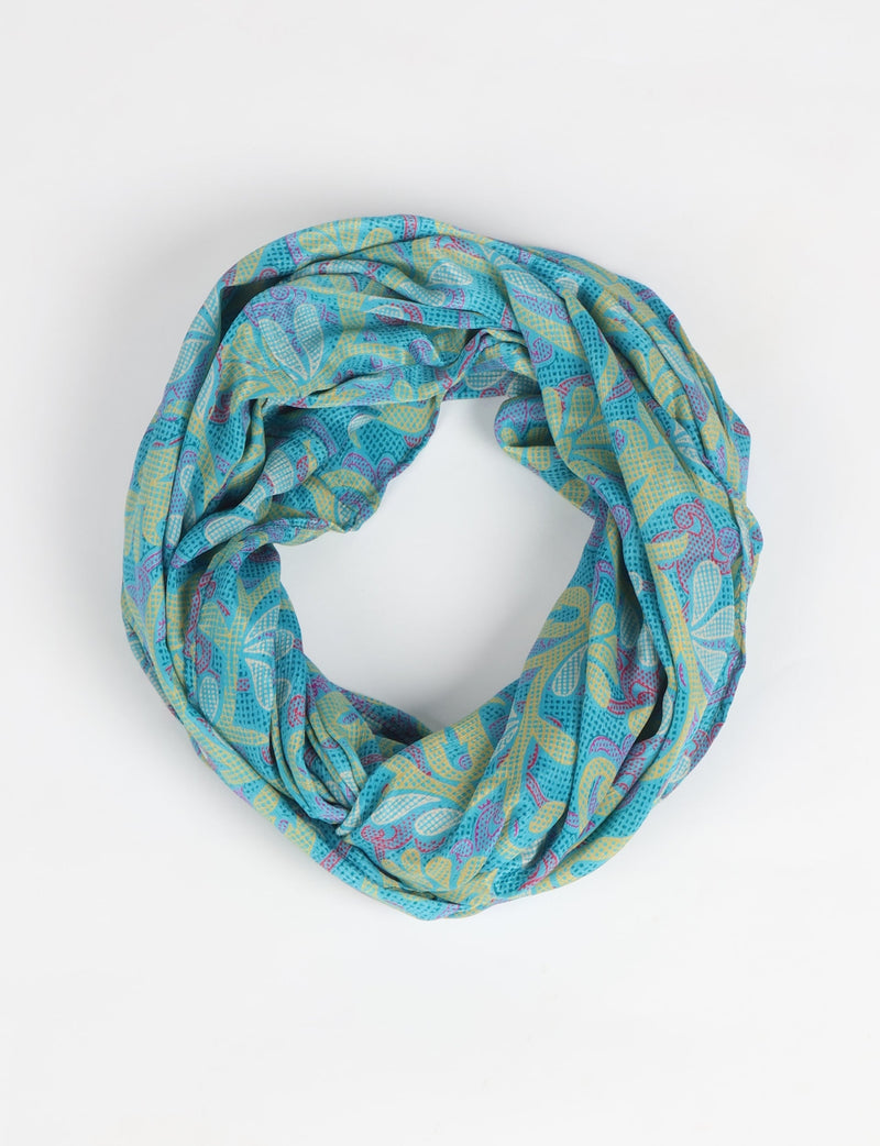 Sustainable style embraces you with our LOOP SCARF – an infinity-style scarf crafted from vibrant, pattern-rich saris. Handcrafted by experienced Mumbai-based artisans, this versatile scarf can be worn looped once or twice around your neck or as a head-wrap. From laid-back beach vacations to dress-to-impress dinners, this scarf is a timeless accessory.