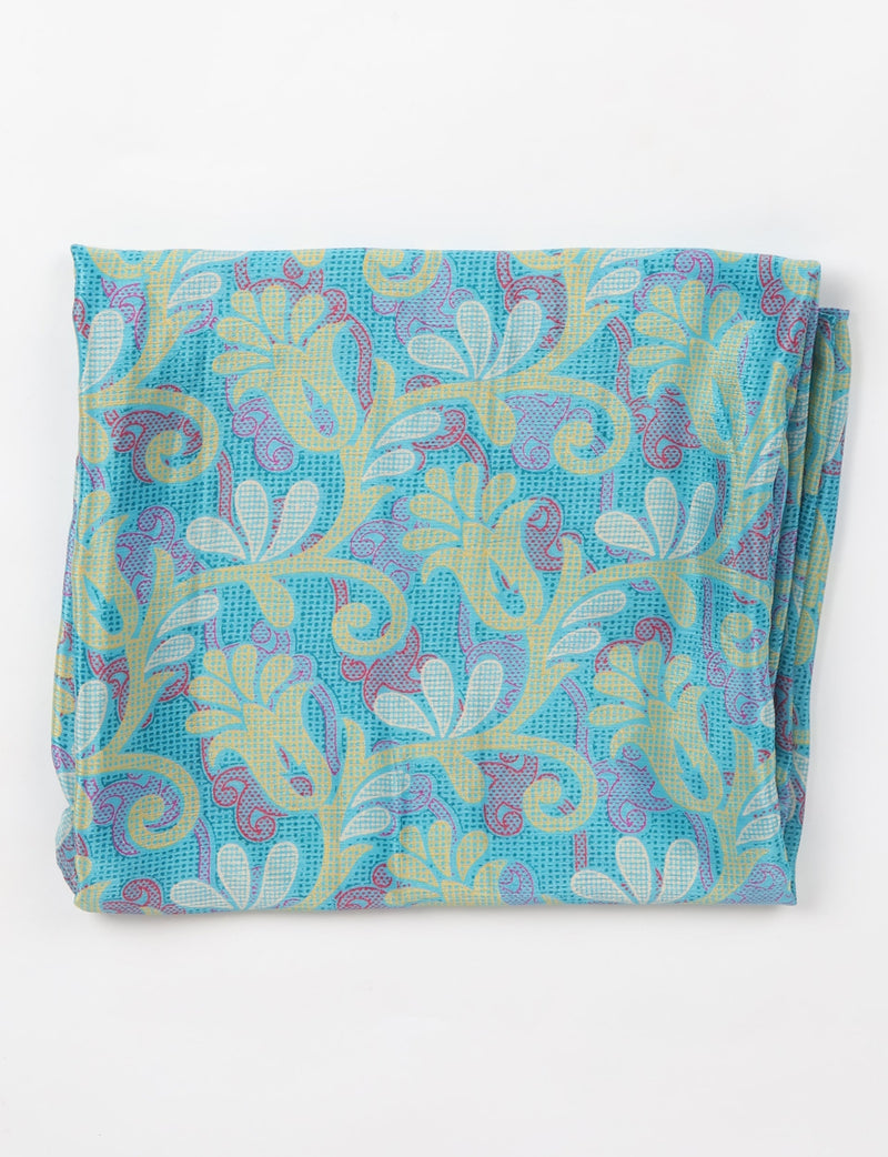 Sustainable style embraces you with our LOOP SCARF – an infinity-style scarf crafted from vibrant, pattern-rich saris. Handcrafted by experienced Mumbai-based artisans, this versatile scarf can be worn looped once or twice around your neck or as a head-wrap. From laid-back beach vacations to dress-to-impress dinners, this scarf is a timeless accessory.