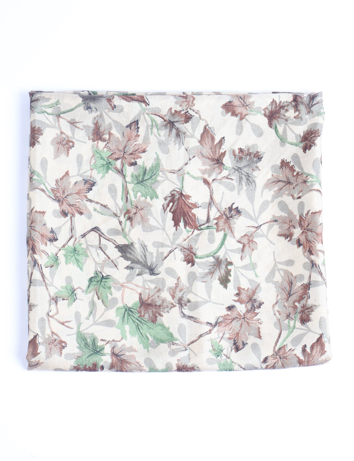 Beige pareo folded flat with a leaf pattern in brown, green, and gray tones on a light background