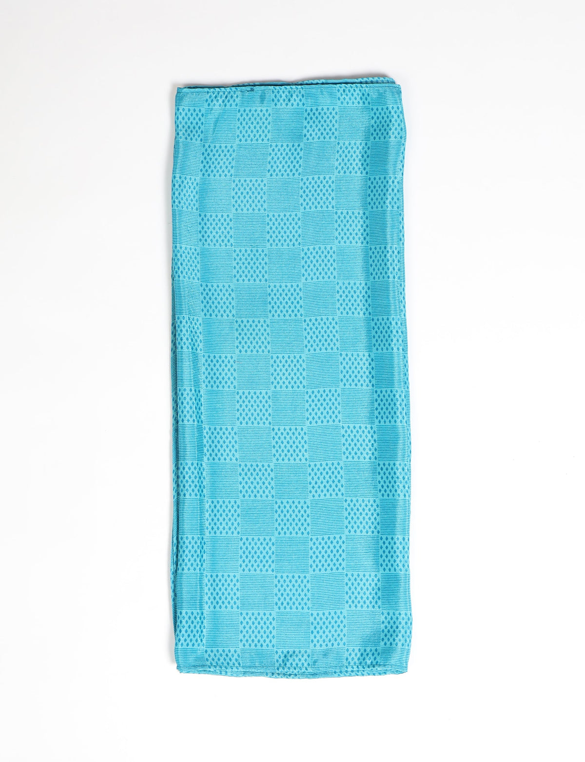 Folded blue stole with alternating geometric square patterns of dots and lines on a white background