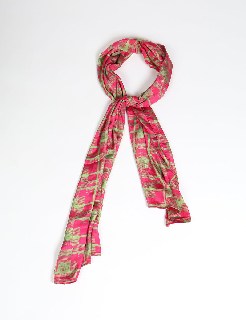 Pink and green abstract patterned stole tied in a loop, flat lay on white background