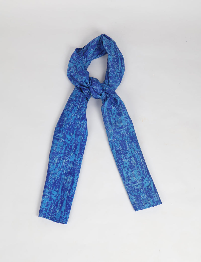 Blue stole with abstract pattern, shown knotted on a white background, rectangular shape with smooth fabric texture