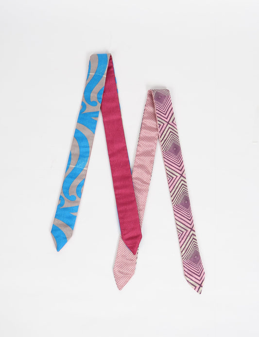 Colorful sustainable headband made from recycled fabric, representing fair trade, circular fashion, and carbon neutral clothing for mindful wardrobes.