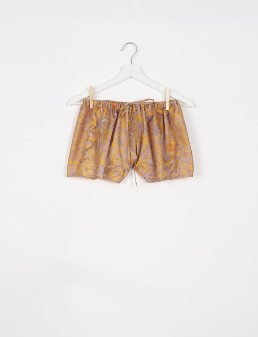 Elevate your wardrobe with our eco-friendly shorts. The all-around elastic waist and drawstring tie provide comfort and style. Crafted with ethical and sustainable practices, these shorts redefine green fashion, making them a perfect addition to your conscious clothing collection.