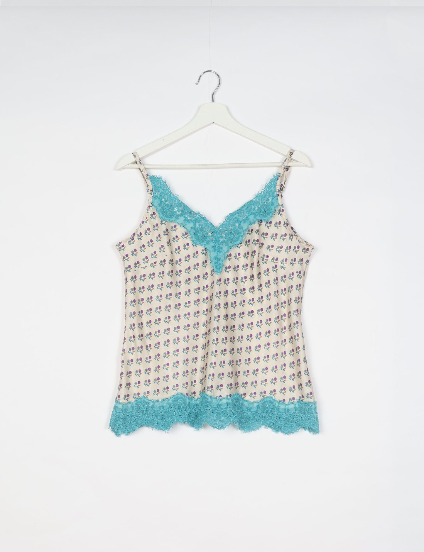 Sleep in eco-friendly luxury with our PJ Set Short. Made for the conscious consumer, these pajamas contribute to zero waste and sustainable practices. The cami top, adorned with delicate eyelash lace and cut on the bias, pairs seamlessly with the comfy shorts featuring an elasticated waist and drawstring tie.