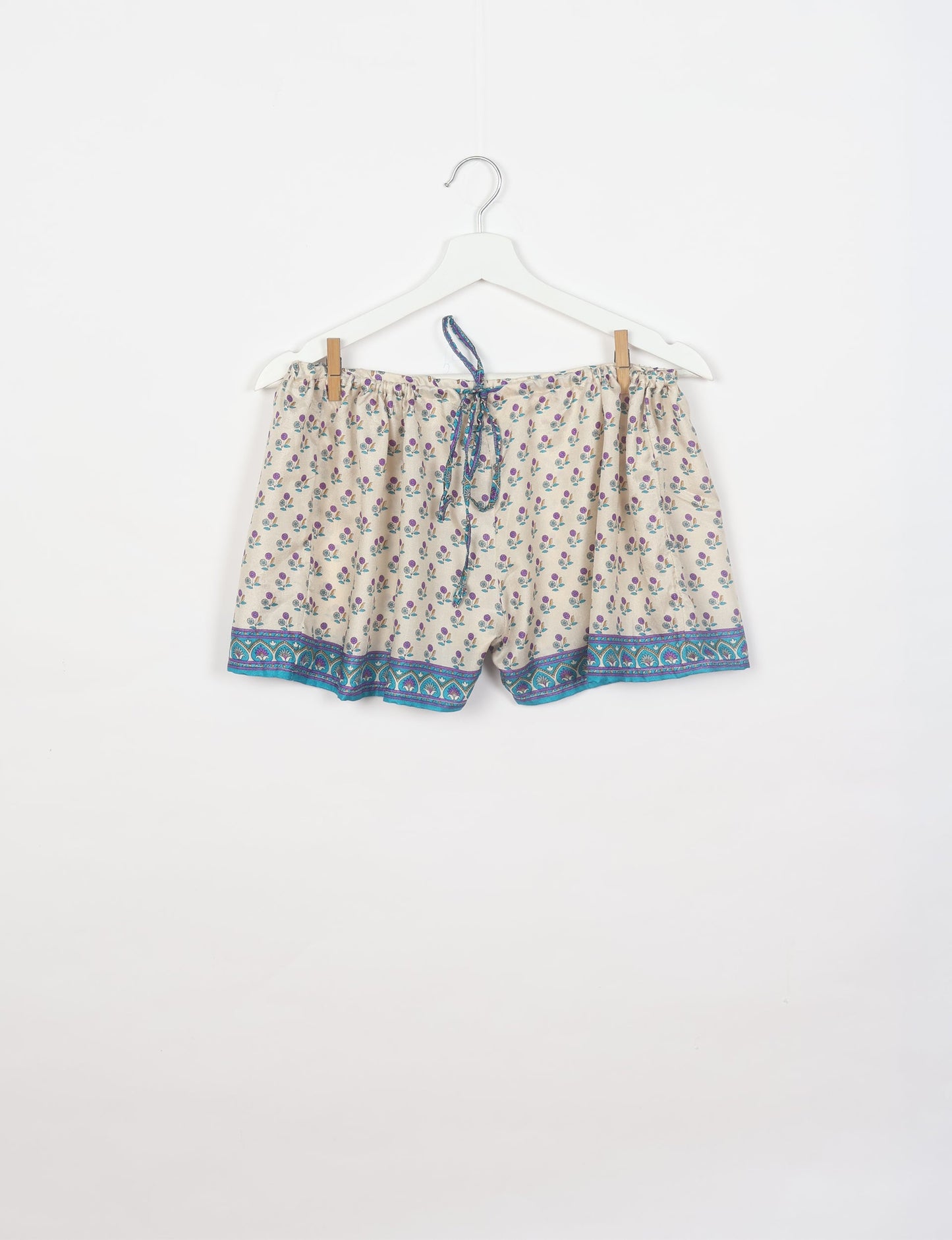 Sleep in eco-friendly luxury with our PJ Set Short. Made for the conscious consumer, these pajamas contribute to zero waste and sustainable practices. The cami top, adorned with delicate eyelash lace and cut on the bias, pairs seamlessly with the comfy shorts featuring an elasticated waist and drawstring tie.