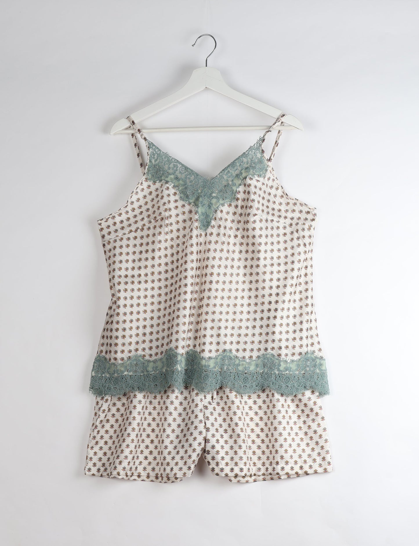 Sleep in eco-friendly luxury with our PJ Set Short. Made for the conscious consumer, these pajamas contribute to zero waste and sustainable practices. The cami top, adorned with delicate eyelash lace and cut on the bias, pairs seamlessly with the comfy shorts featuring an elasticated waist and drawstring tie.