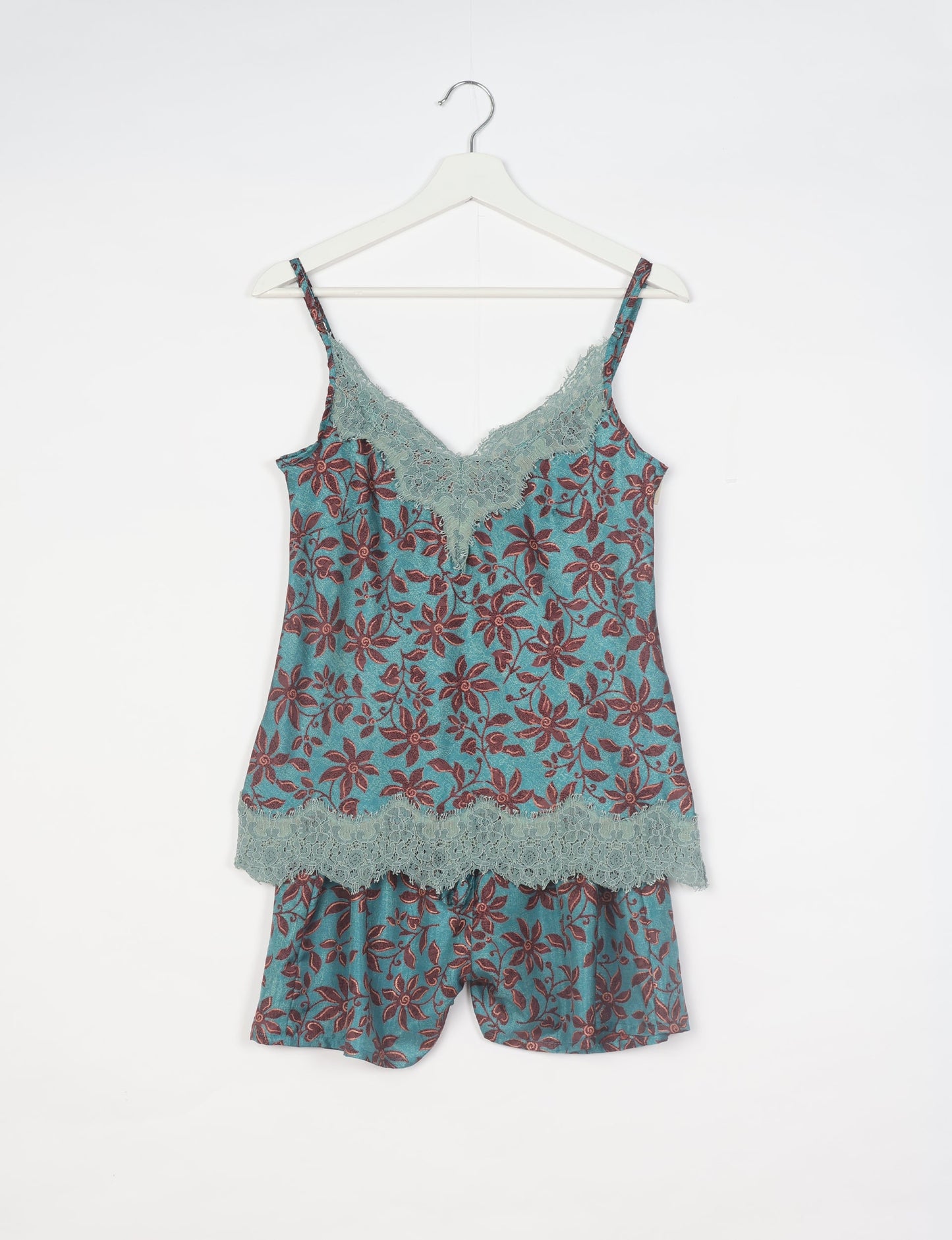 Sleep in eco-friendly luxury with our PJ Set Short. Made for the conscious consumer, these pajamas contribute to zero waste and sustainable practices. The cami top, adorned with delicate eyelash lace and cut on the bias, pairs seamlessly with the comfy shorts featuring an elasticated waist and drawstring tie.