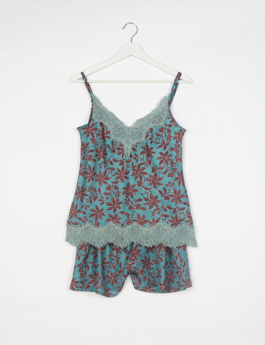 Sleep in eco-friendly luxury with our PJ Set Short. Made for the conscious consumer, these pajamas contribute to zero waste and sustainable practices. The cami top, adorned with delicate eyelash lace and cut on the bias, pairs seamlessly with the comfy shorts featuring an elasticated waist and drawstring tie.