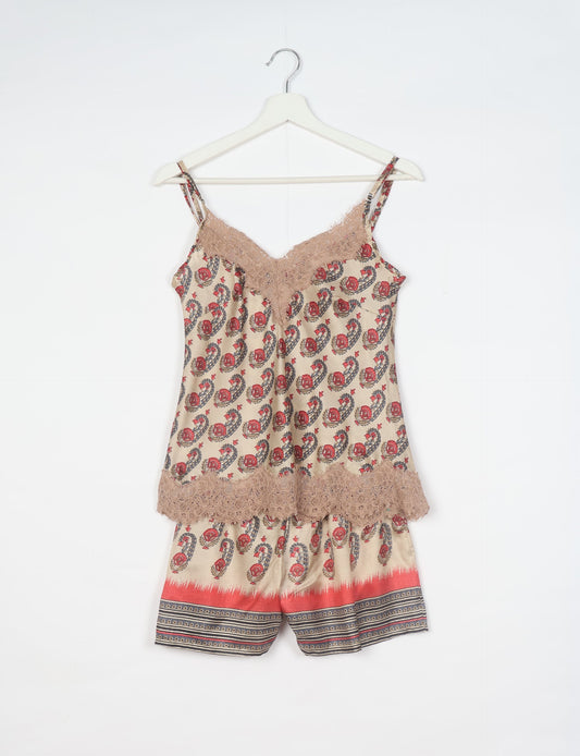 Sleep in eco-friendly luxury with our PJ Set Short. Made for the conscious consumer, these pajamas contribute to zero waste and sustainable practices. The cami top, adorned with delicate eyelash lace and cut on the bias, pairs seamlessly with the comfy shorts featuring an elasticated waist and drawstring tie.