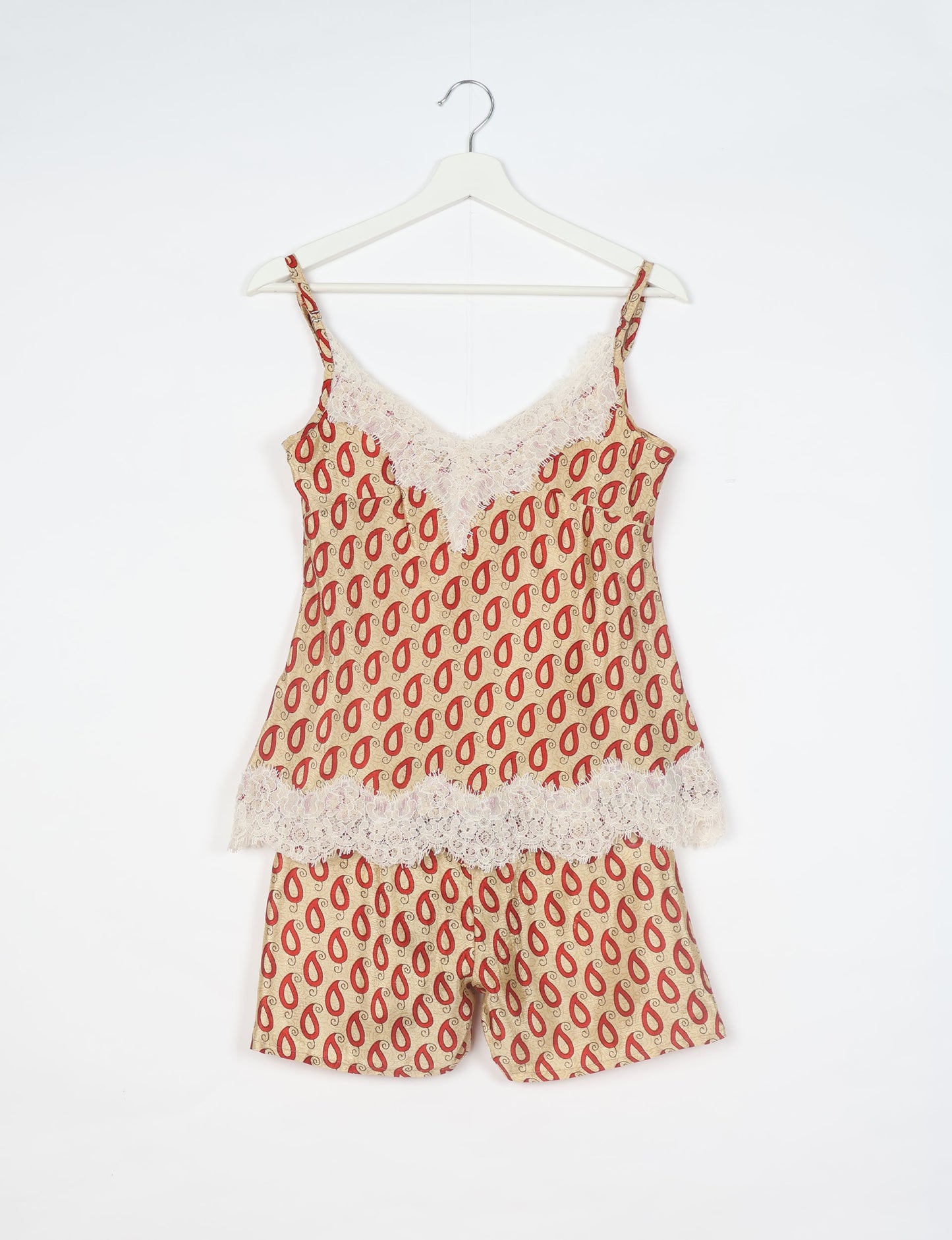 Sleep in eco-friendly luxury with our PJ Set Short. Made for the conscious consumer, these pajamas contribute to zero waste and sustainable practices. The cami top, adorned with delicate eyelash lace and cut on the bias, pairs seamlessly with the comfy shorts featuring an elasticated waist and drawstring tie.