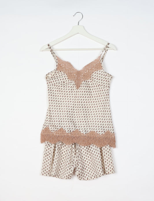 Sleep in eco-friendly luxury with our PJ Set Short. Made for the conscious consumer, these pajamas contribute to zero waste and sustainable practices. The cami top, adorned with delicate eyelash lace and cut on the bias, pairs seamlessly with the comfy shorts featuring an elasticated waist and drawstring tie.