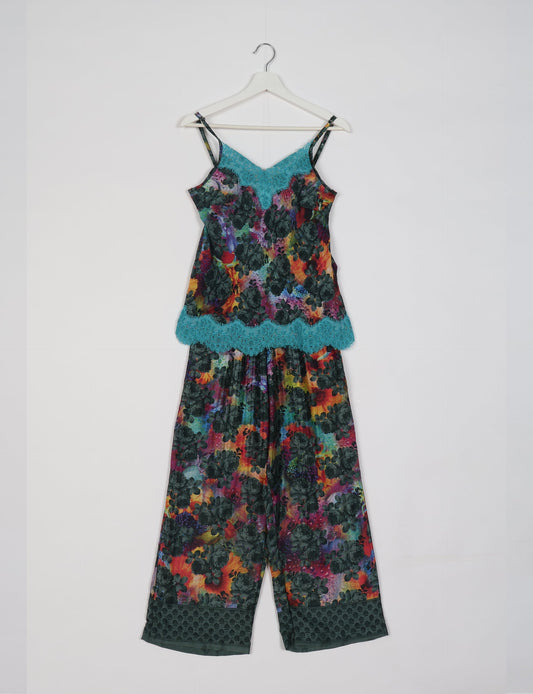 Discover the epitome of ethical sleepwear with our PJ Set Long – a blend of comfort, sustainability, and chic design. Crafted by skilled Mumbai artisans from upcycled saris, these pajamas redefine eco-friendly fashion, offering a conscious choice for your wardrobe.