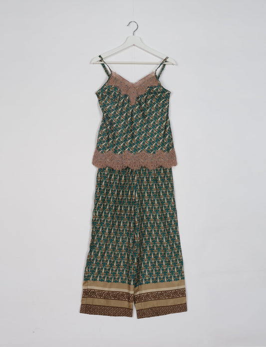 Discover the epitome of ethical sleepwear with our PJ Set Long – a blend of comfort, sustainability, and chic design. Crafted by skilled Mumbai artisans from upcycled saris, these pajamas redefine eco-friendly fashion, offering a conscious choice for your wardrobe.