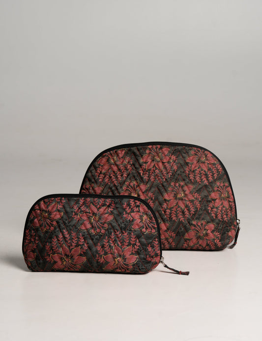 A set of two Vanity Pouches, featuring embellished beaded pullers, made from sustainable materials for eco-conscious travelers.