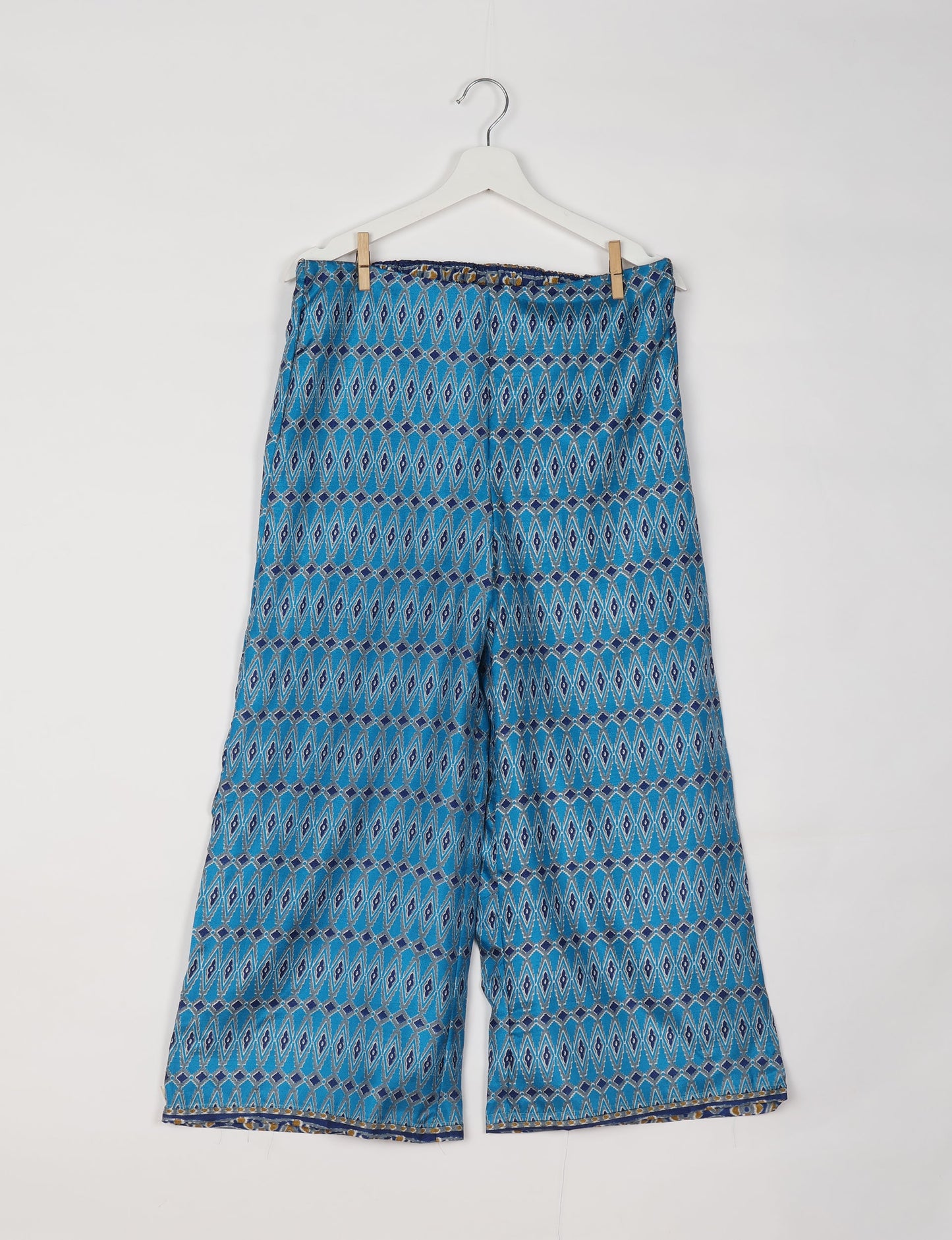Step into sustainable fashion with our Palazzo Pants – a harmonious blend of Indian and Italian influences. These wide-legged pants, made from upcycled saris, offer comfort with an all-around elastic waist and a stylish flared leg. Make a statement with eco-friendly, chic palazzo pants that redefine ethical clothing.