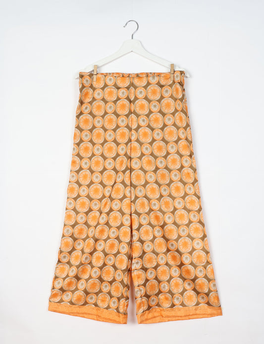Step into sustainable fashion with our Palazzo Pants – a harmonious blend of Indian and Italian influences. These wide-legged pants, made from upcycled saris, offer comfort with an all-around elastic waist and a stylish flared leg. Make a statement with eco-friendly, chic palazzo pants that redefine ethical clothing.